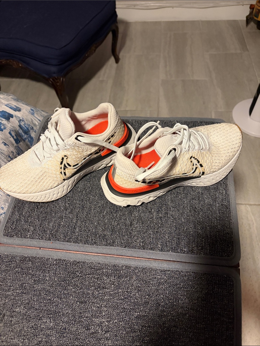Nike Cream Knit Athletic Shoes with Orange and Black Accents